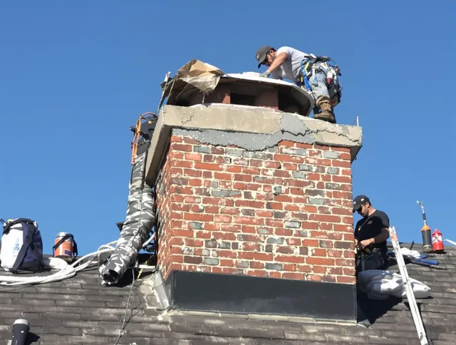 Avon Chimney Sweep installing a custom chimney crown in Avon, CT