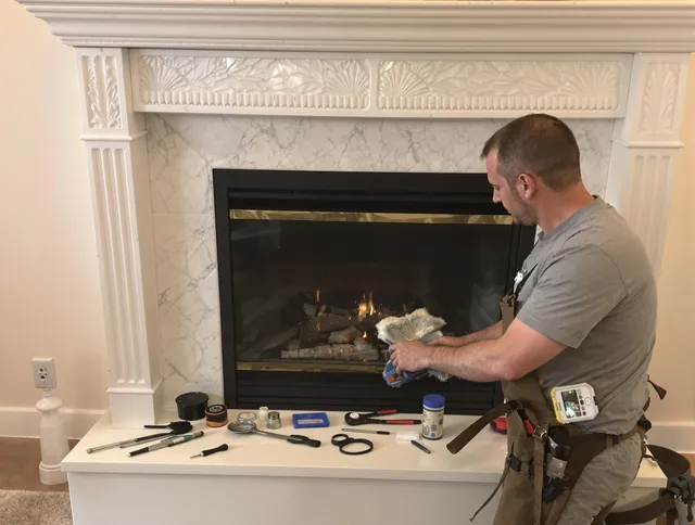 Avon Chimney Sweep performing fireplace maintenance in Avon, CT